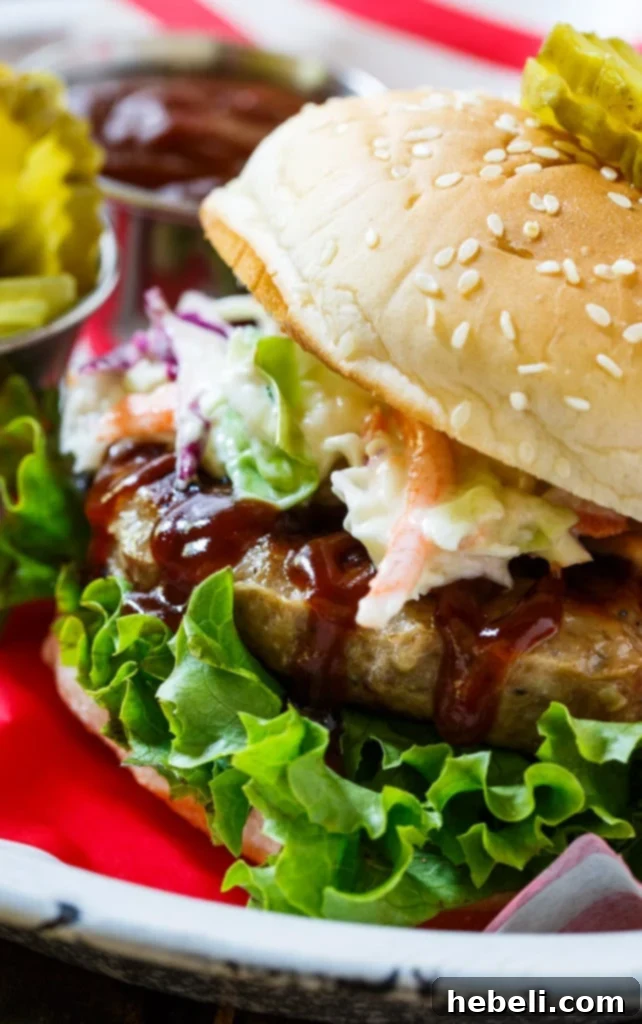 Southern BBQ Pork Burgers with creamy coleslaw and BBQ sauce.