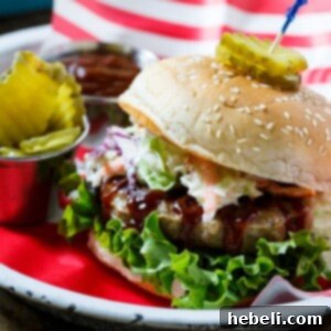 Southern BBQ Pork Burgers with creamy coleslaw and BBQ sauce.