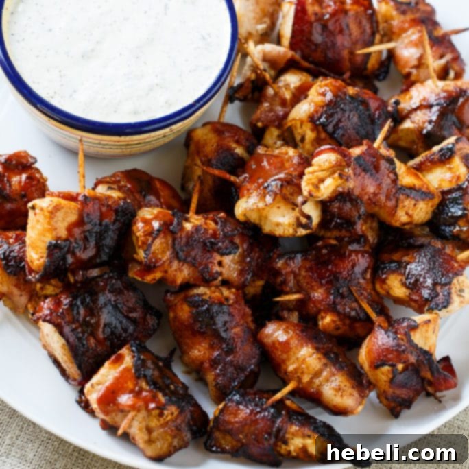 Smoky BBQ Bacon Chicken Poppers 2 Delicious BBQ Bacon Chicken Bites, perfect for grilling season.