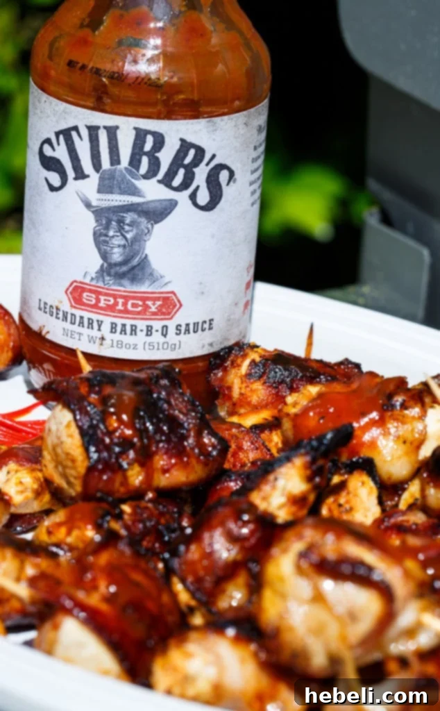 Smoky BBQ Bacon Chicken Poppers 3 Close-up of grilled BBQ Bacon Chicken Bites on a platter.