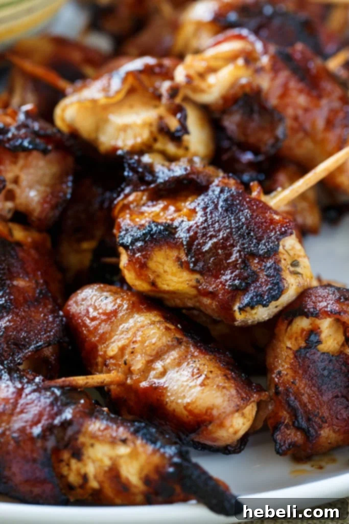 Smoky BBQ Bacon Chicken Poppers 4 BBQ Bacon Chicken Bites arranged on a serving tray, ready to eat.