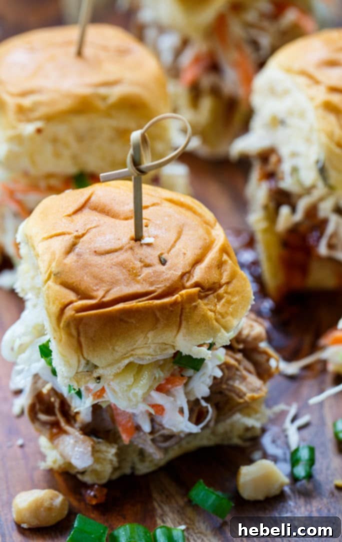 Close-up of Hawaiian Sliders with vibrant Tropical Slaw and savory fillings