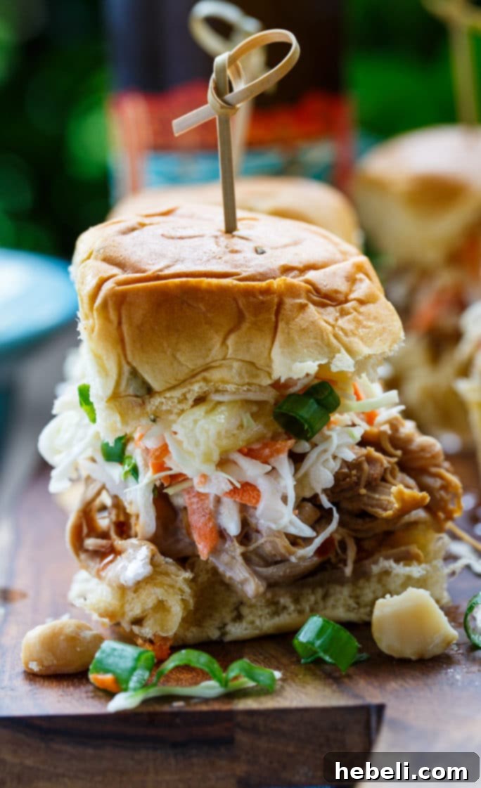 Hawaiian Pulled Pork Sliders topped with fresh Tropical Slaw