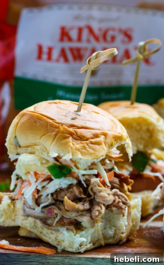 A serving of Hawaiian Sliders with Tropical Slaw, highlighting the vibrant colors and fresh ingredients like pineapple and macadamia nuts