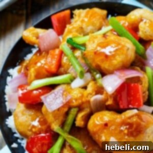 Homemade Sweet and Sour Chicken recipe card image, showcasing the final dish.