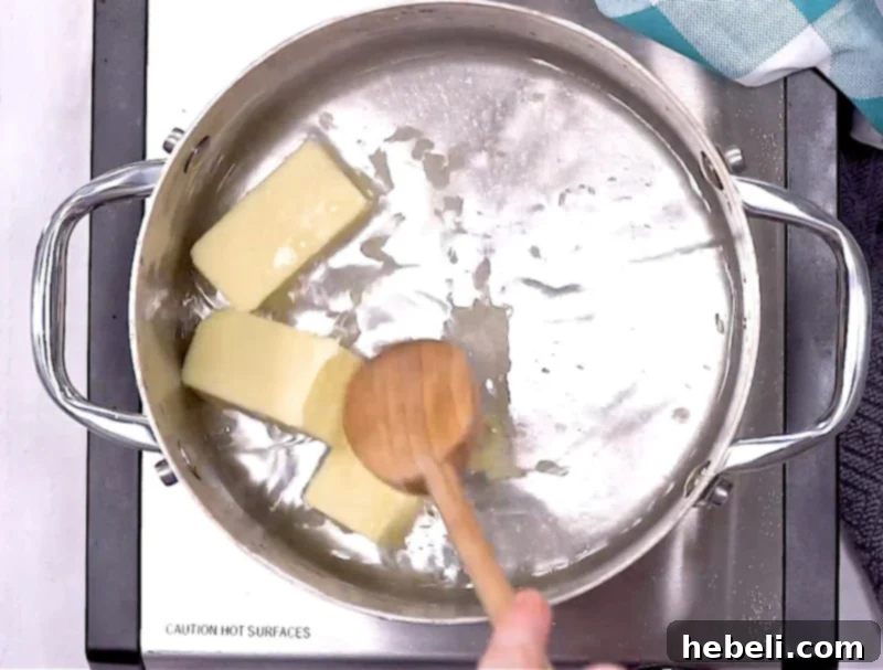 Melting butter in a saucepan on the stovetop.