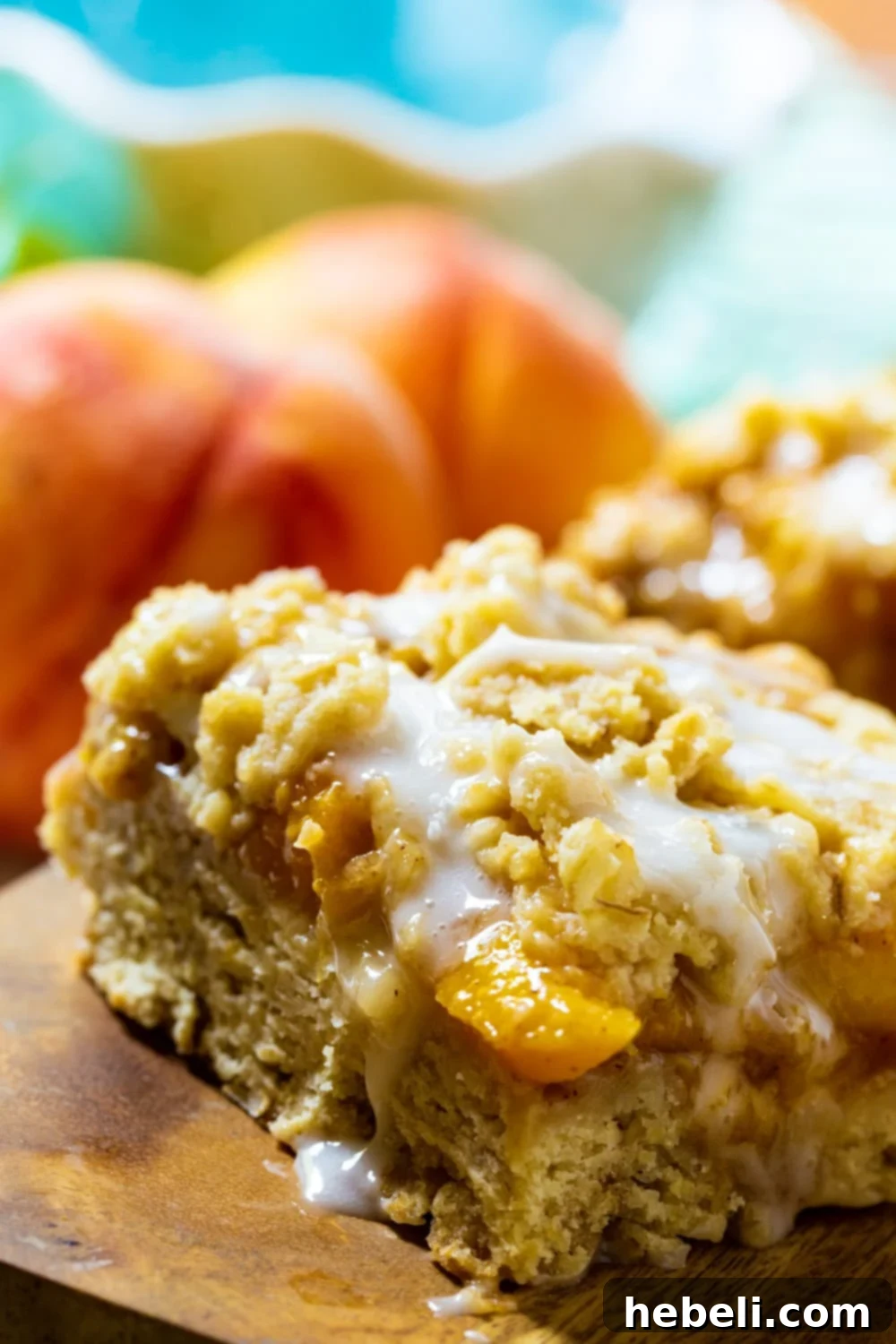 Easy and Delicious Peach Cobbler Bars 5 Close-up detailed shot of a single Peach Cobbler Bar, showing the peach filling and crumbly topping.