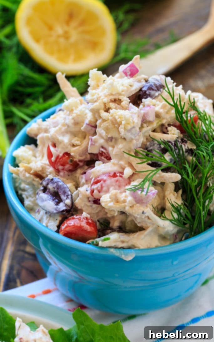 Sun-Drenched Greek Chicken Salad 7 Greek Chicken Salad with tomatoes, cucumbers, feta cheese, and olives.