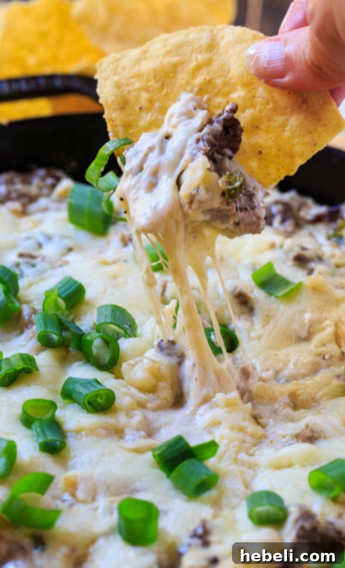 Mixing the creamy base for Philly Cheese Steak Dip