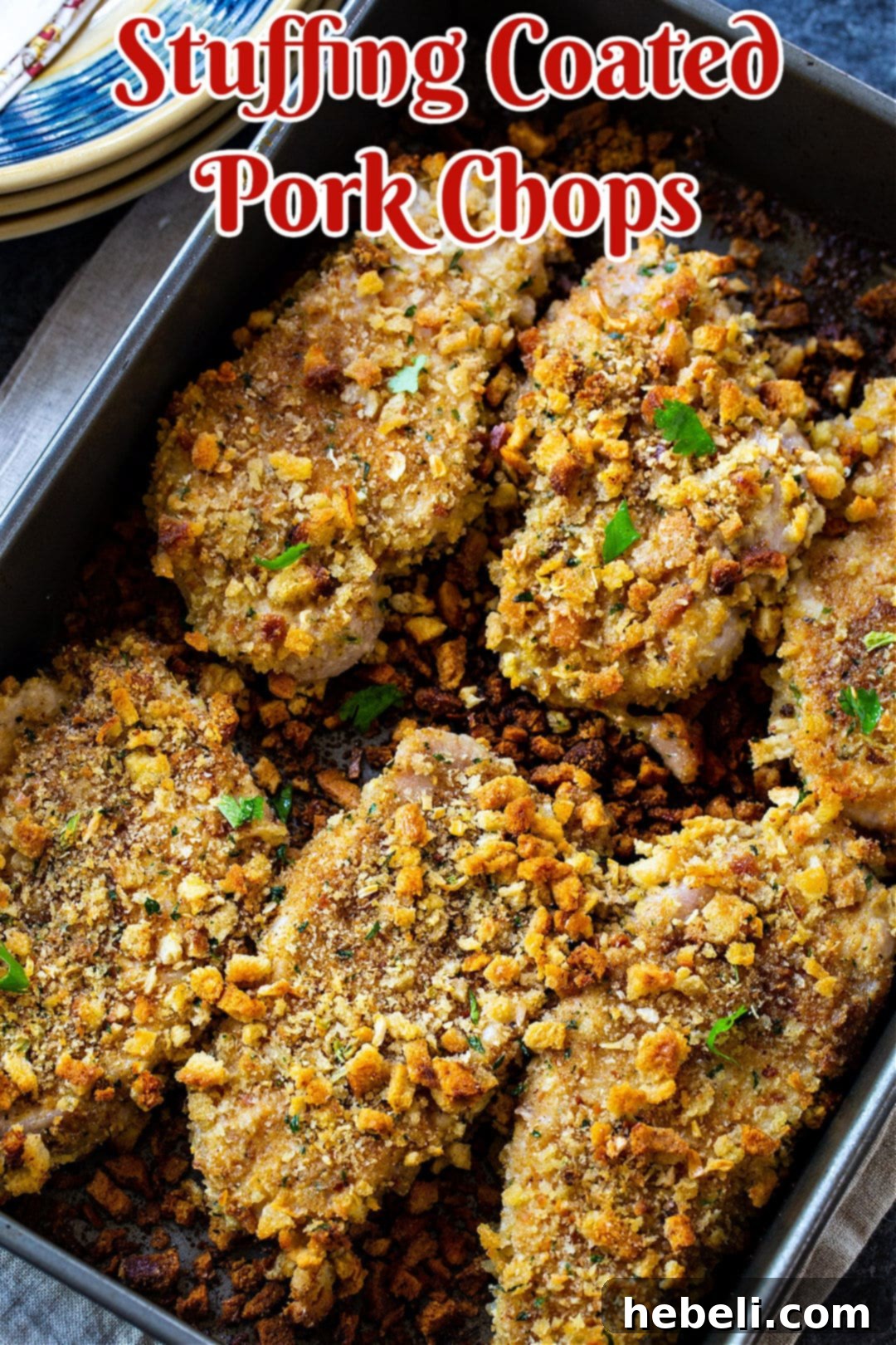Stuffing Coated Pork Chops in baking dish.