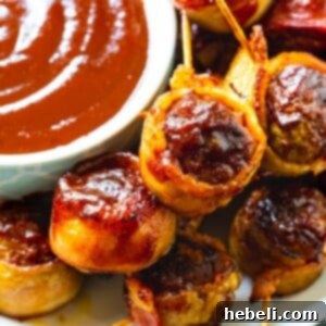 Barbecue Bacon Meatballs on a plate with bowl of bbq sauce, ready for serving.