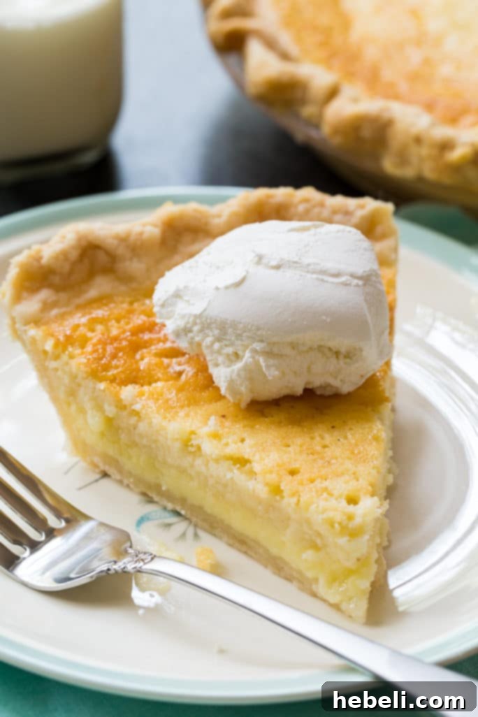 A whole Old-fashioned Buttermilk Pie on a cooling rack, ready to be enjoyed