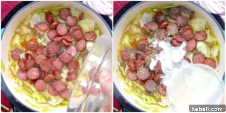 Cooked sausage slices and heavy cream being stirred into the simmering soup in a pot.