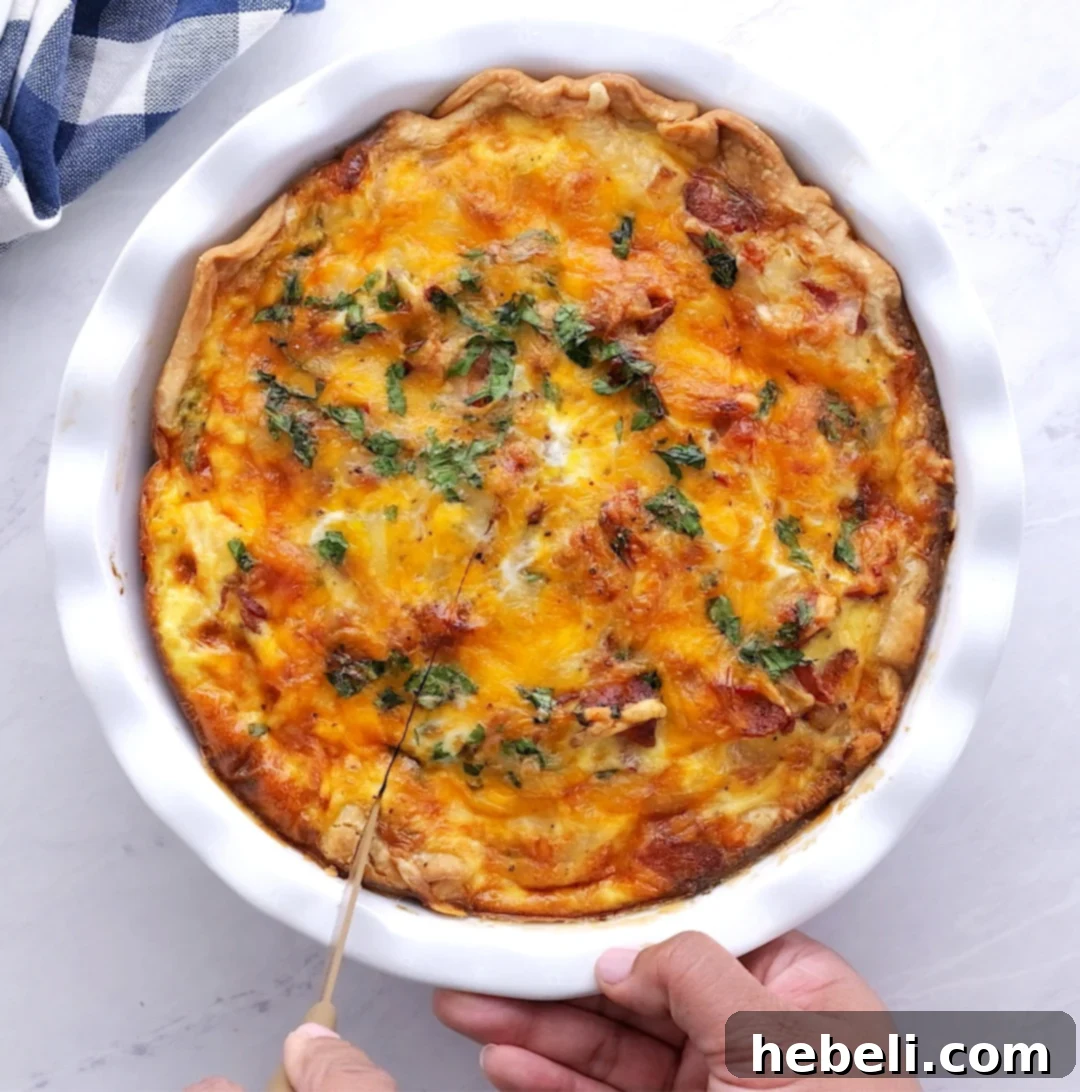 Slicing the baked Bacon and Potato Quiche after cooling.