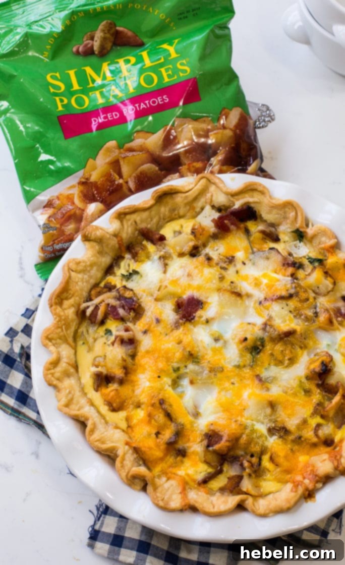 Farmhouse Bacon Potato Quiche 3 A close-up of a slice of Bacon and Potato Quiche, showcasing the crispy bacon and tender potato pieces.