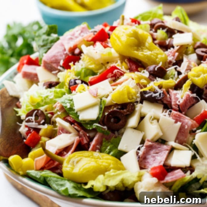 Zesty Italian Deli Salad 2 Muffaletta Salad: A vibrant and hearty New Orleans-inspired chopped salad with fresh greens, deli meats, cheeses, and olives.
