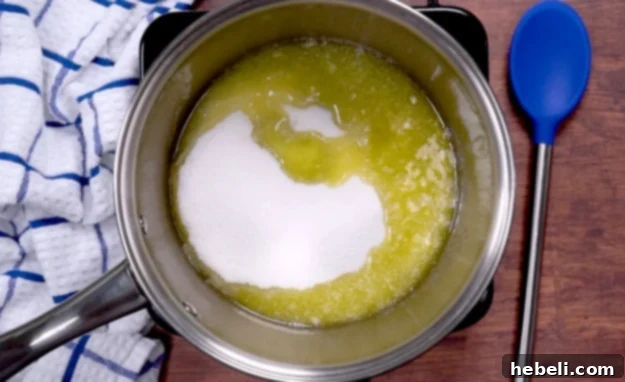 Sugar and melted butter in a saucepan, cooling slightly.