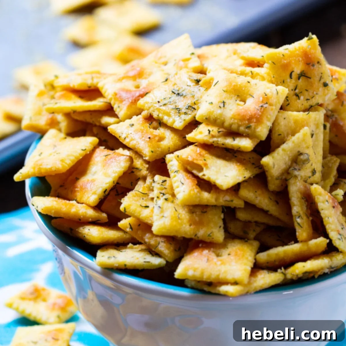Zesty Ranch Cheez-Its 2 A bowl overflowing with golden brown, perfectly seasoned Ranch Cheez-Its, ready for snacking.