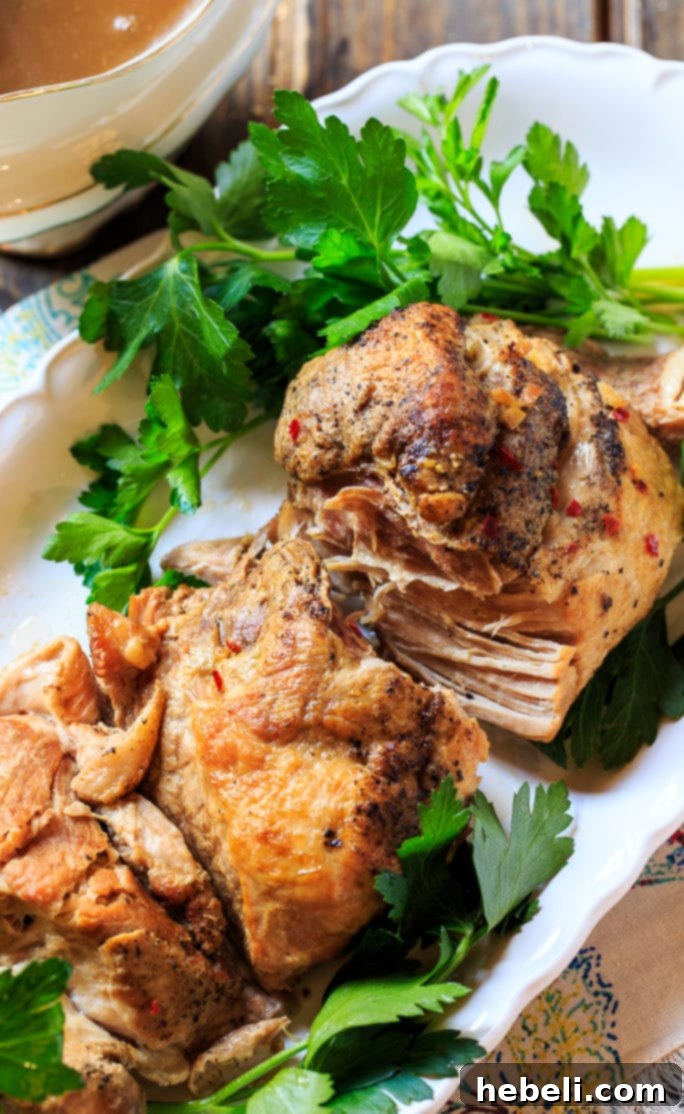 Crock Pot Pork Loin close-up, showcasing its moist interior and delicious gravy