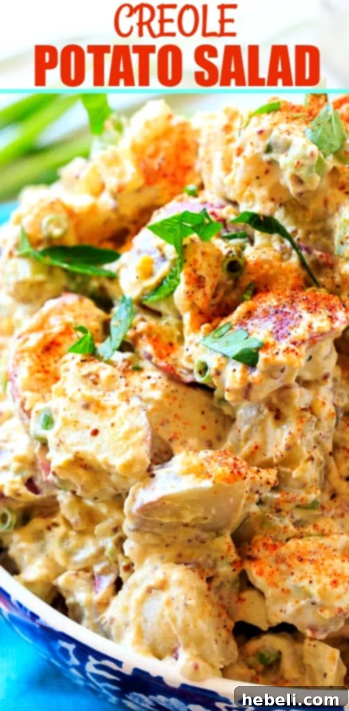 Close-up of Creole Potato Salad, garnished with fresh herbs