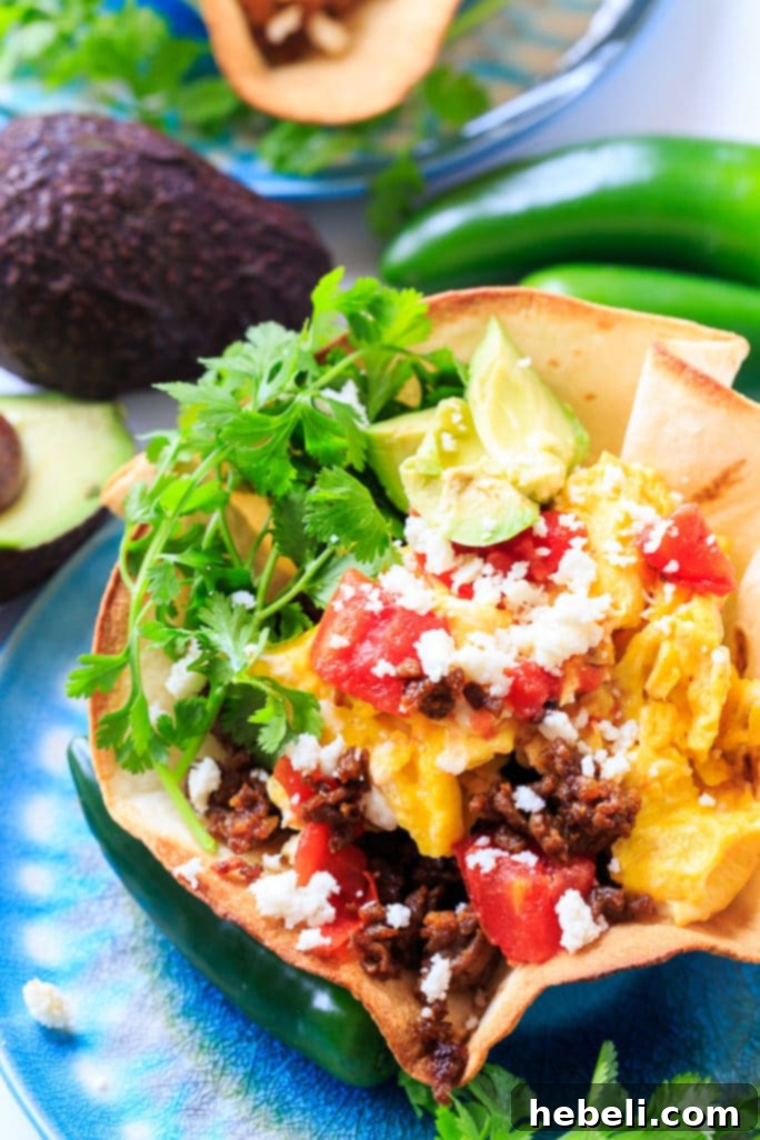 Spicy Chorizo Ranchero Skillet 5 Chorizo and Eggs Ranchero with queso fresco, avocado, and cilantro on top.