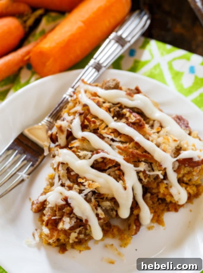 Carrot Coffee Cake with a generous layer of cream cheese glaze and pecan-coconut crumb topping