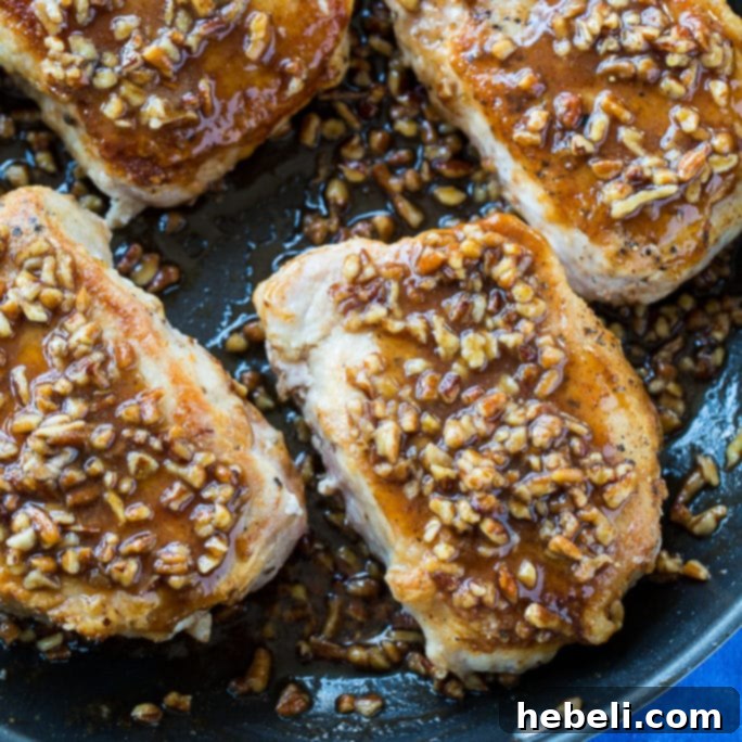Close-up of golden brown Honey Pecan Pork Chops with a glistening glaze