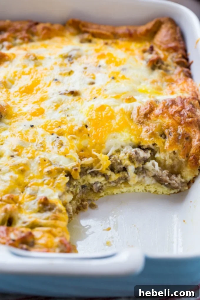 Sausage Crescent Bake 4 Sausage and Crescent Roll Casserole fresh out of the oven, golden brown and bubbling