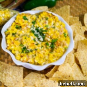 Finished Spicy Mexican Street Corn Dip in a serving bowl, garnished with fresh cilantro.