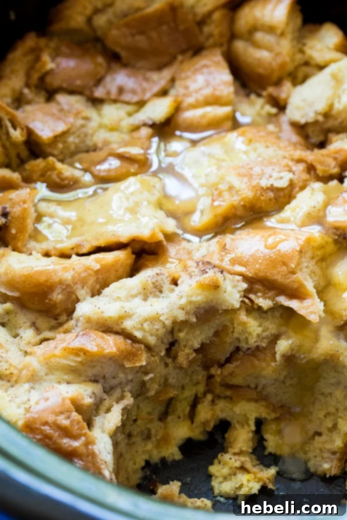 Luscious Slow Cooker Tres Leches Bread Pudding 3 Slow Cooker Tres Leches Bread Pudding with a generous drizzle of homemade vanilla sauce