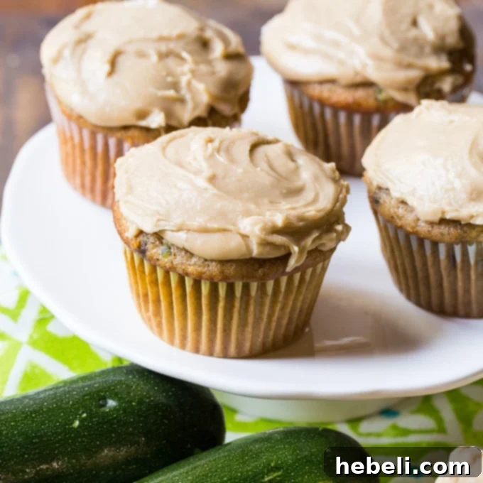 Moist Zucchini Cupcakes with rich Caramel Frosting and mini chocolate chips, perfect for summer dessert
