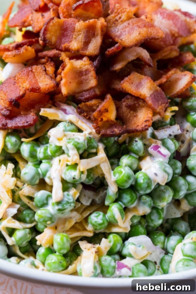 A beautifully presented bowl of Creamy Pea Salad, highlighting its creamy texture and fresh ingredients.