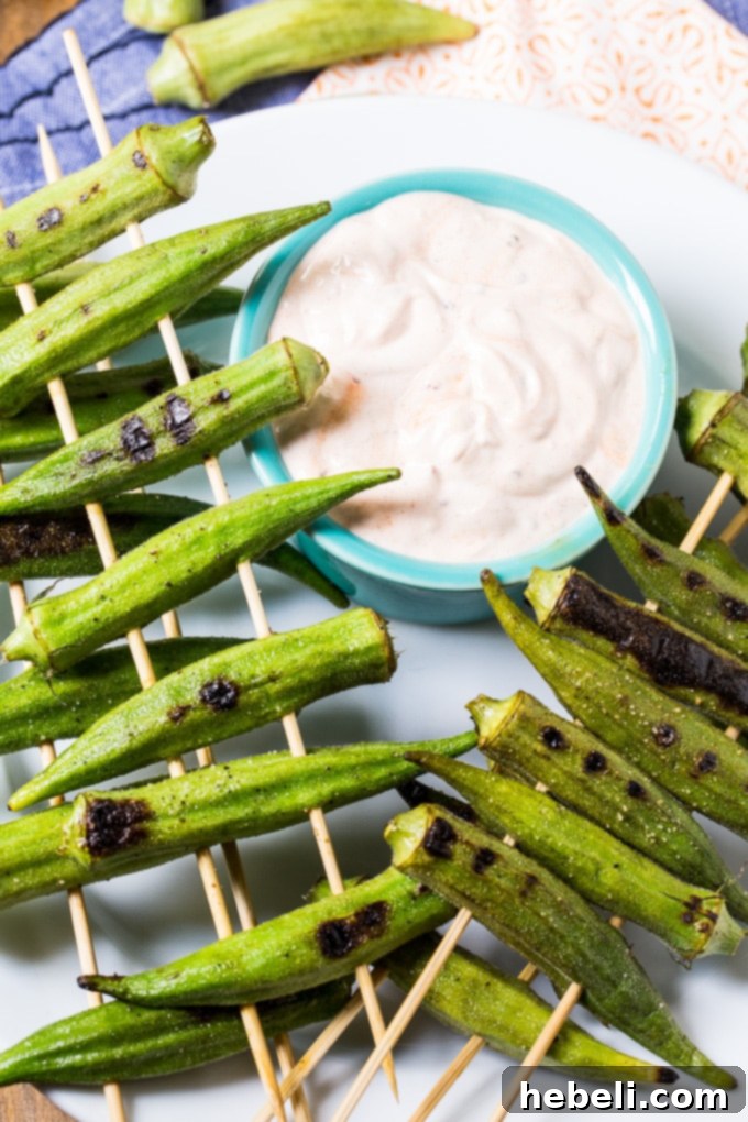 Smoky Chipotle Grilled Okra 5 Fresh okra pods before grilling, showcasing their vibrant green color.