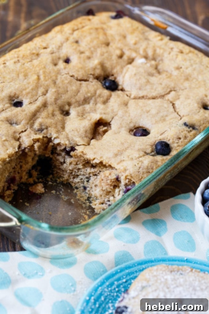 Fluffy Blueberry Pancake Dream 4 Close-up of a slice of Blueberry Pancake Cake with blueberries