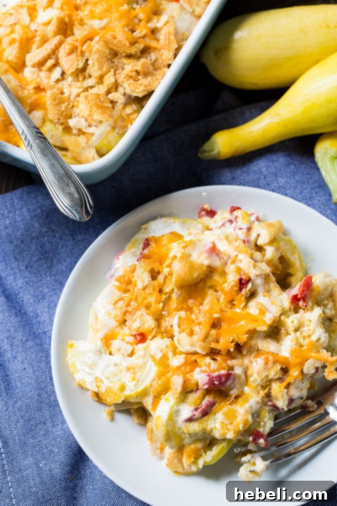 Another perspective of the Pimento Cheese Squash Casserole, emphasizing its rich texture and appealing presentation.