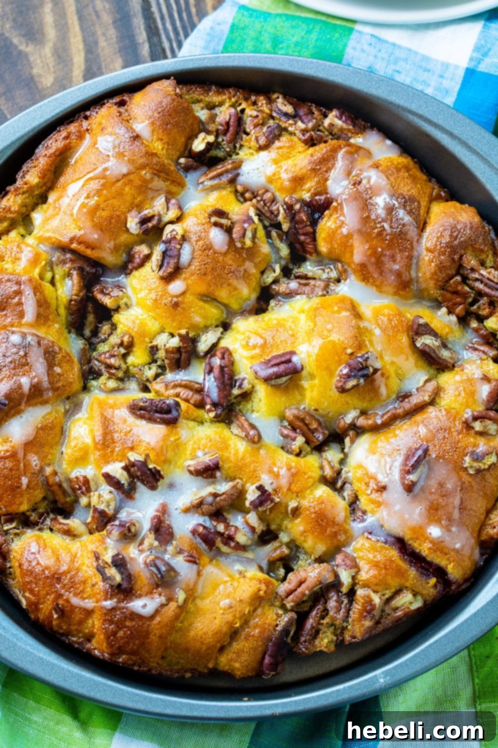 Golden Crescent Coffee Swirl 3 Freshly baked Crescent Roll Coffee Cake in a 9-inch round pan, ready to be glazed.