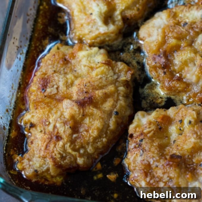 Golden Crispy Honey Garlic Pork Chops 2 Perfectly cooked Crunchy Honey Garlic Pork Chops ready to be served