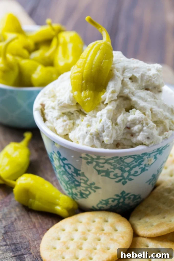 Close-up of the creamy Three Cheese Pepperoncini Spread, showing its rich texture and finely chopped pepperoncini pieces.