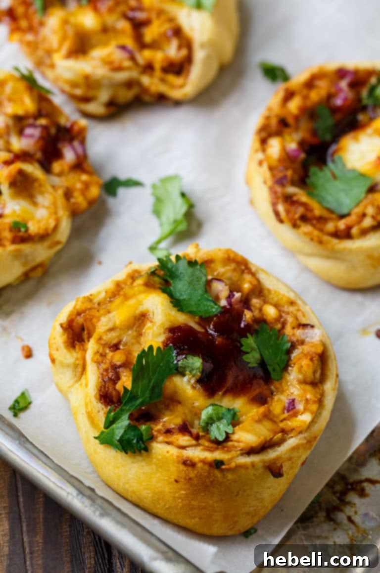Close-up of baked BBQ Chicken Crescent Pinwheels, golden and delicious, making a great snack or appetizer.