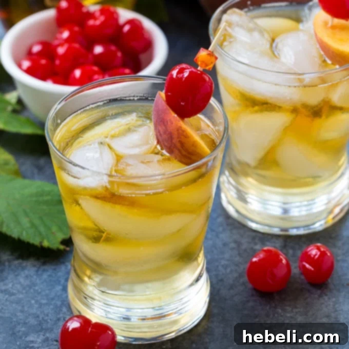A refreshing Peach Old-Fashioned cocktail, perfect for summer.