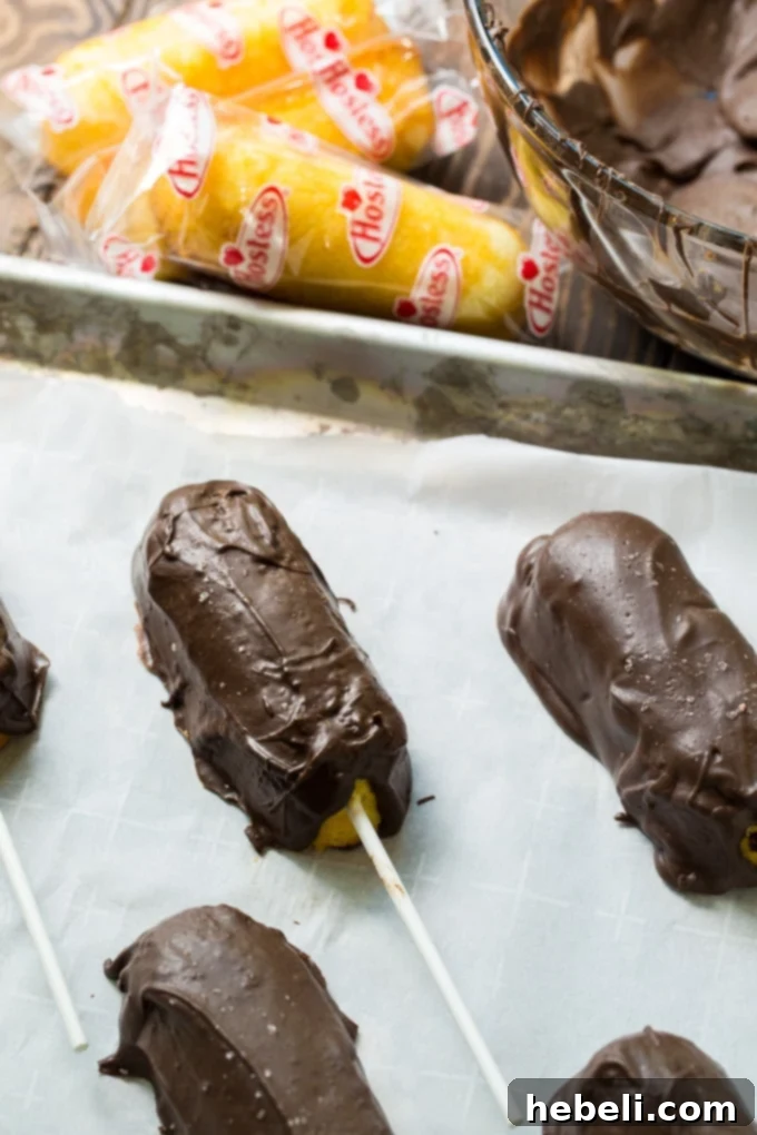 Chocolate Covered Bourbon Soaked Twinkies arranged elegantly on a serving plate