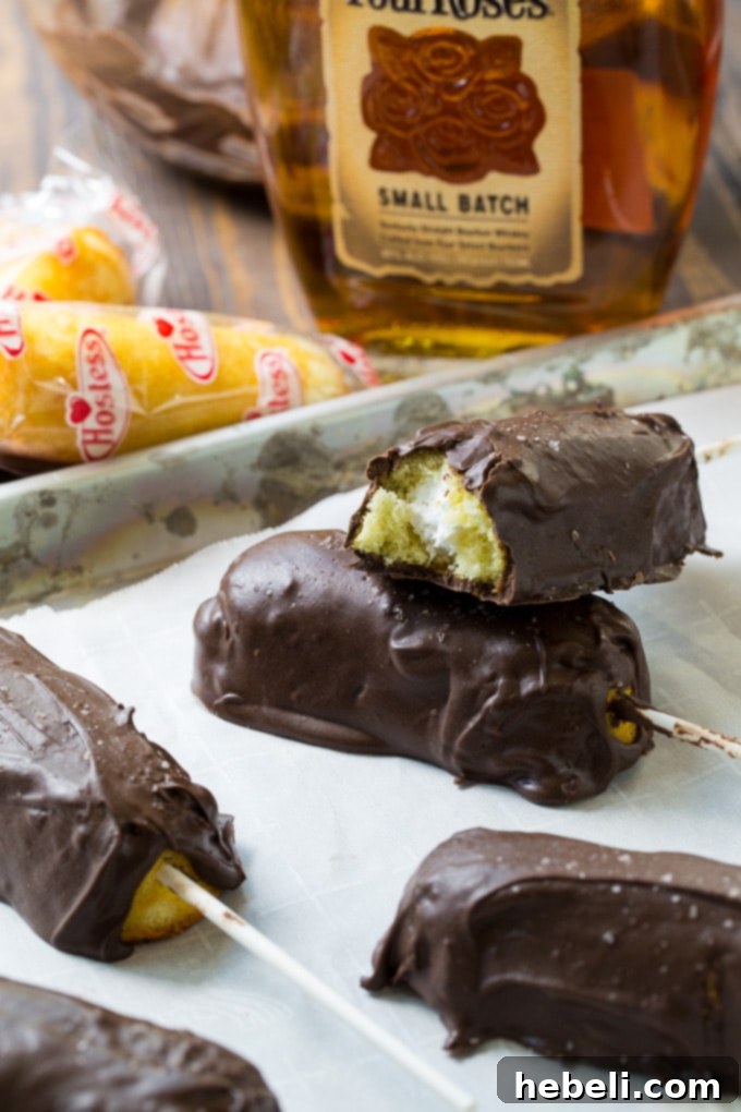 Beautifully presented Chocolate Covered Bourbon Soaked Twinkies on a white plate