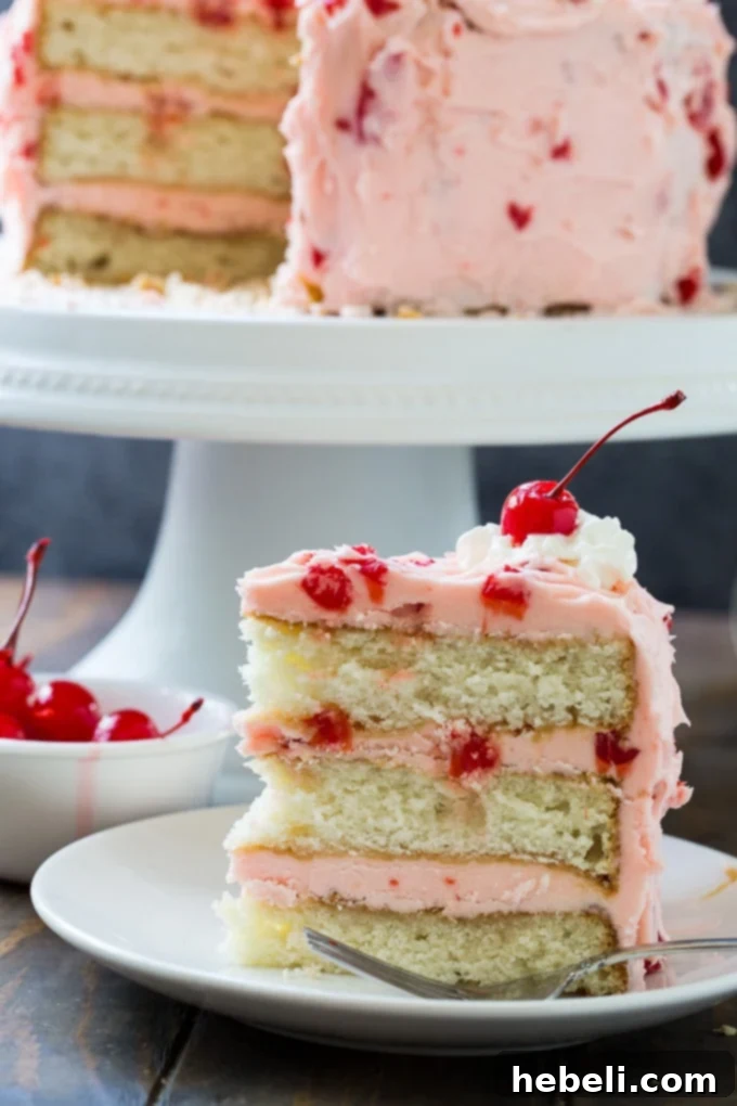Full view of White Cake with Maraschino Cherry Frosting on a stand