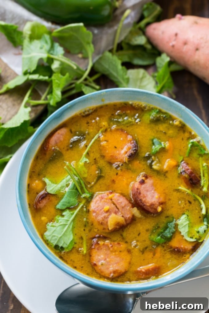 Warm bowl of Sausage and Sweet Potato Soup, perfect for using Thanksgiving leftovers