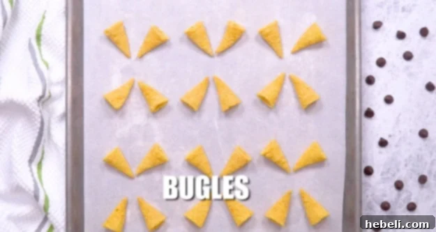Bugles on baking sheet, ready for filling.