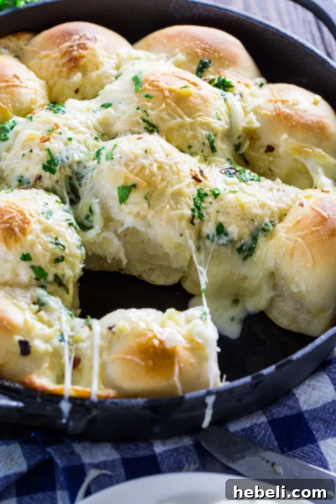 Cheesy Garlic Skillet Rolls stuffed with mozzarella cheese and ready to bake