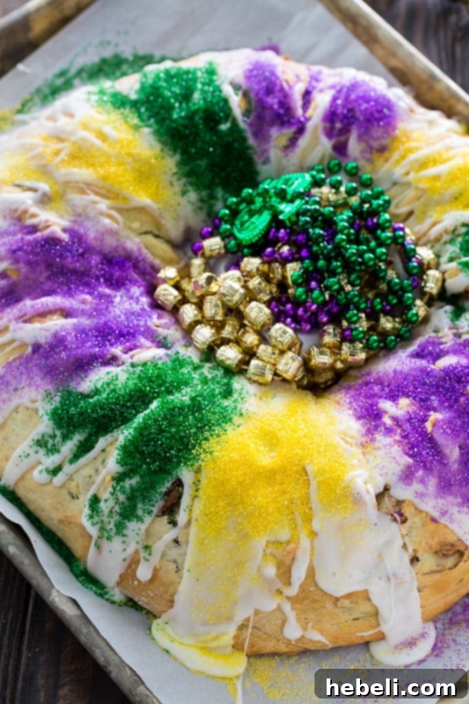 Cinnamon-Pecan King Cake - Slice with baby