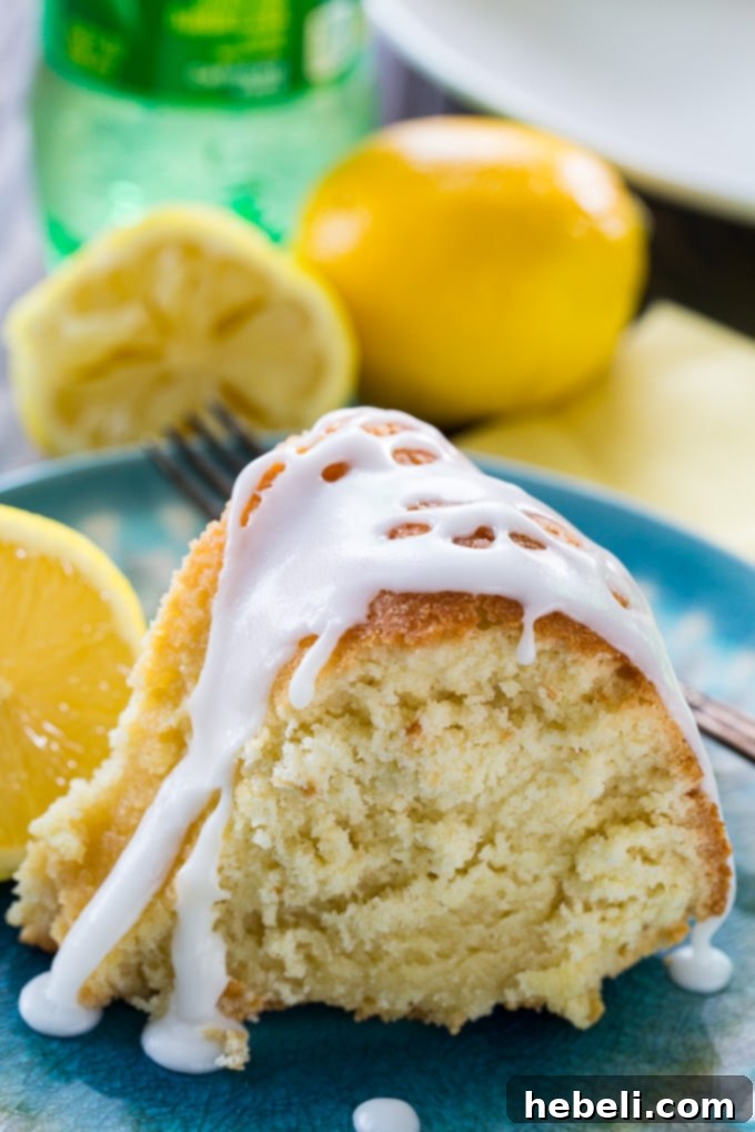 Sparkling Citrus Cake 3 Close-up of a lemon-flavored 7UP cake, showcasing its moist texture and golden crust, inviting a taste.