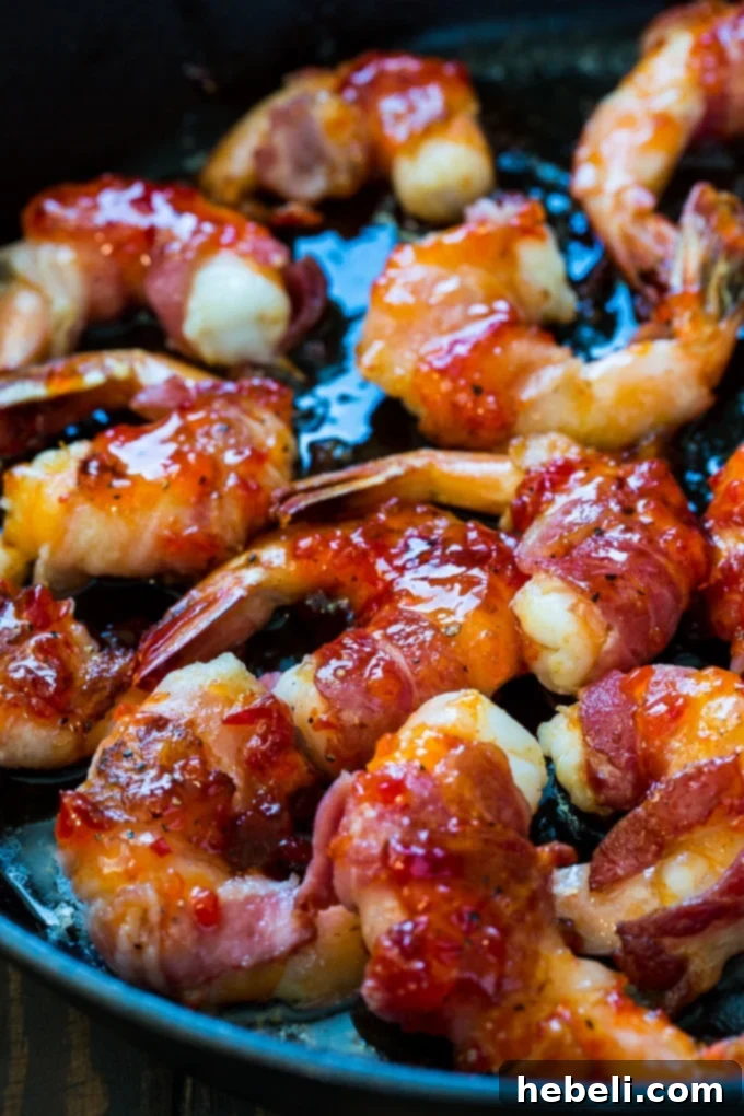 Plated Bacon Wrapped Shrimp with Pepper Jelly Glaze, ready to serve.