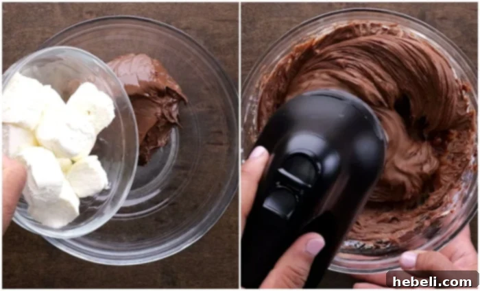 Creamy Nutella and softened cream cheese being beaten together in a mixing bowl.